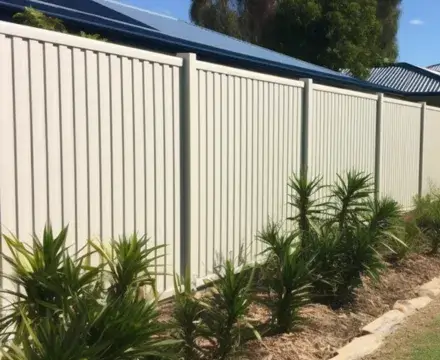 A newly installed white Colorbond fence in Hobart