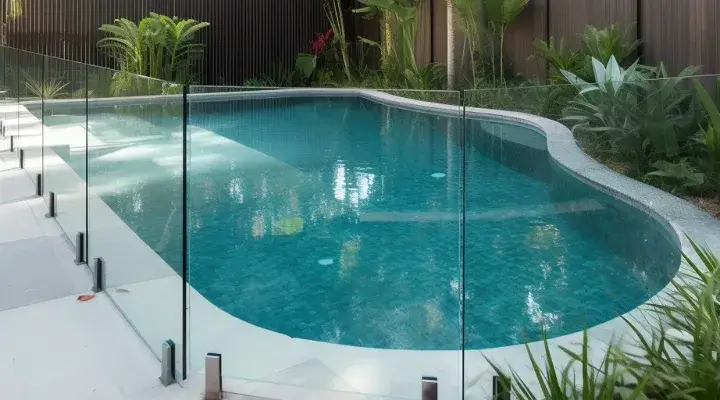Elegant glass pool fence for a small backyard pool by Lifestyle Fencing Hobart